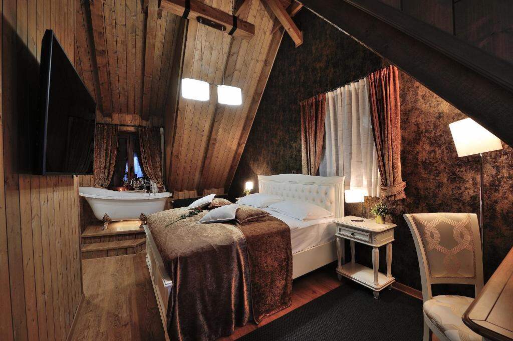 Romantic attic room with a freestanding bathtub